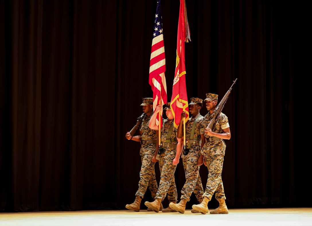U.S. Marines with Marine Corps Installations East-Marine Corps Base Camp Lejeune (MCIEAST-MCB) color guard march during the MCIEAST change of command ceremony ​on MCB Camp Lejeune, North Carolina, June 22, 2023. Brig. Gen. Andrew M. Niebel relinquished command of MCIEAST-MCB Camp Lejeune to Col. Adolfo Garcia Jr.