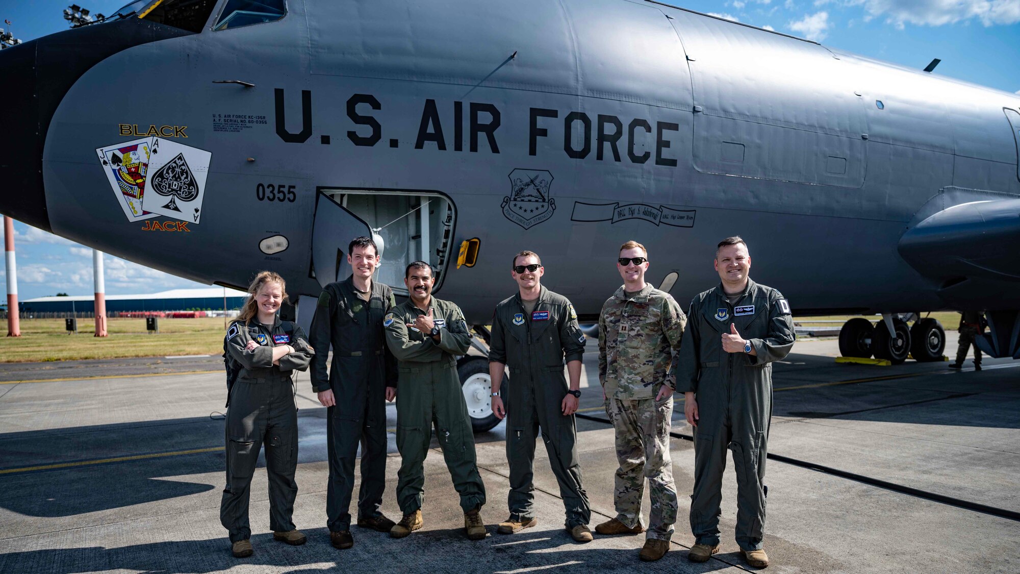 A group of U.S. Air Force Airmen from the 351 take a “Crewfie” or photo of the air crew shortly after landing from a refueling mission involving U.S. Navy jets over the North Sea region at Royal Air Force Mildenhall, England, June 21, 2023. The air crew enabled critical refueling while also conducting routine job-specific training for pilots, boom operators, and a flight doctor. (U.S. Air Force photo by Senior Airman Viviam Chiu)