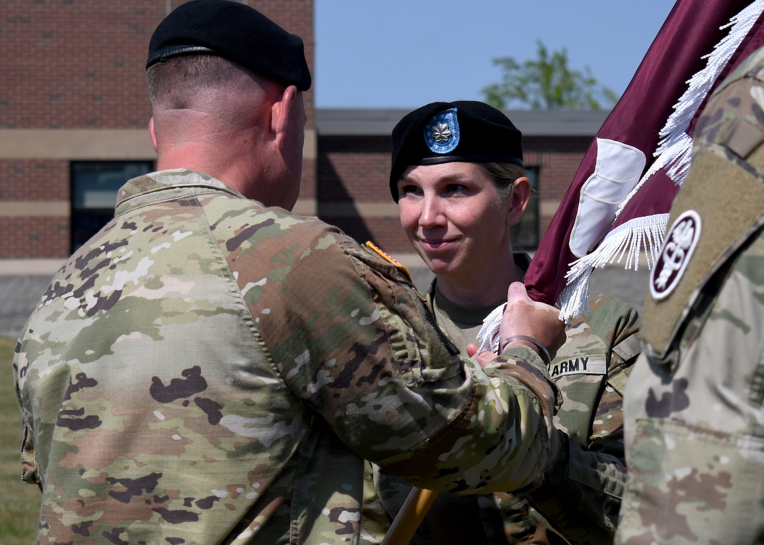 U.S. Army Lt. Col. Lisa M. Heiss, the new commander of the Soldier Recovery Unit – Fort Drum, receives the unit’s flag, or colors, from Col. Matthew J. Mapes, commander of the U.S. Army Medical Department Activity – Fort Drum, during a change of command ceremony at Fort Drum, N.Y., June 20, 2023.