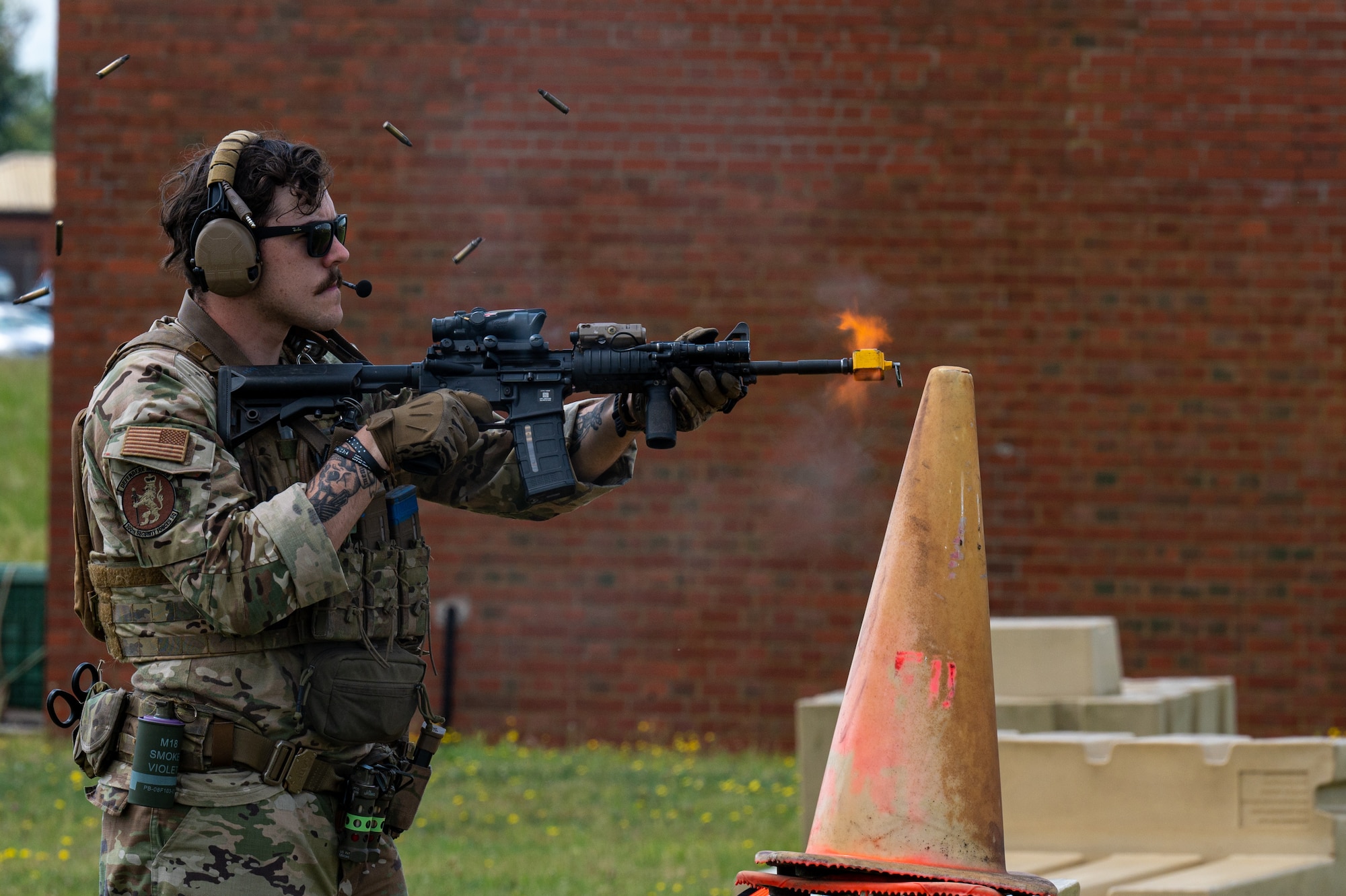 U.S. Air Force Senior Airman Austin Parks, 100th Security Forces Squadron instructor, fires blank ammunition during a training exercise at Royal Air Force Mildenhall, England, June 21, 2023.