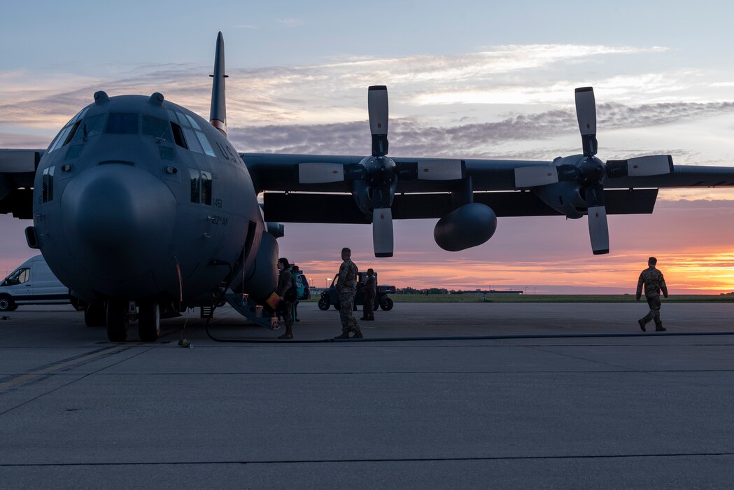 A C-130 Hercules operated by the 182nd Airlift Wing, Illinois National Guard, is readied on the flightline