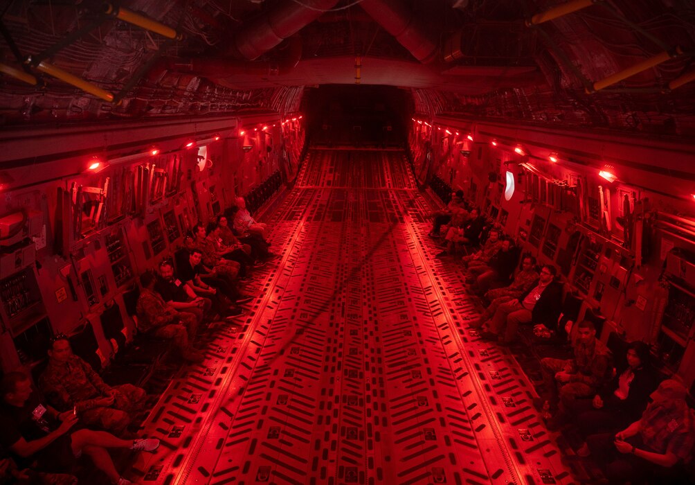 Employer Support of the Guard and Reserve members and 512th Airlift Wing Airmen sit inside the cargo bay of a C-17 Globemaster III