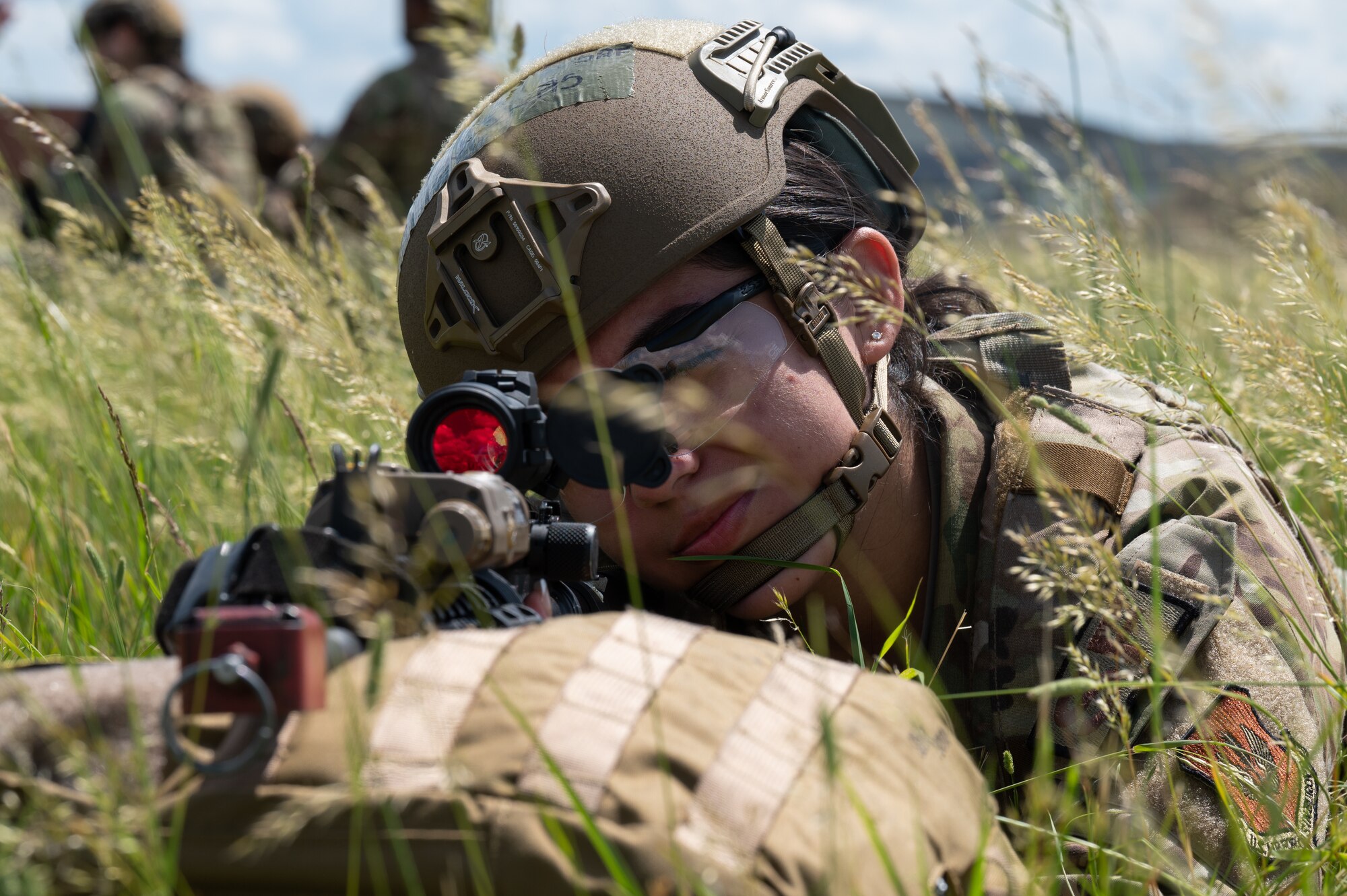U.S. Air Force Airman 1st Class Vivianna Ornelas, 100th Security Forces Squadron response force member, lies prone in a simulated austere environment at Royal Air Force Mildenhall, England, June 21, 2023.