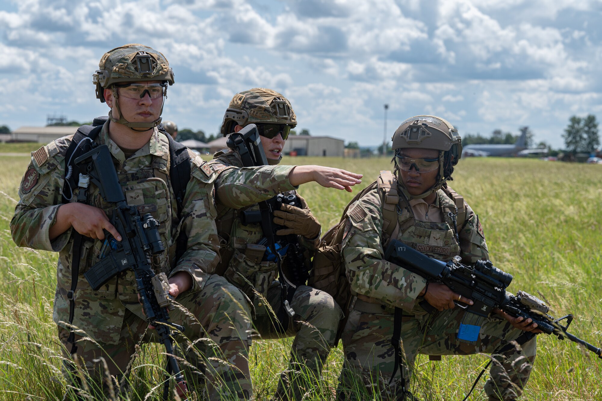 U.S. Air Force Airmen assigned to the 100th Security Forces Squadron, receive instruction from a fire team leader during a training exercise at Royal Air Force Mildenhall, England, June 21, 2023.