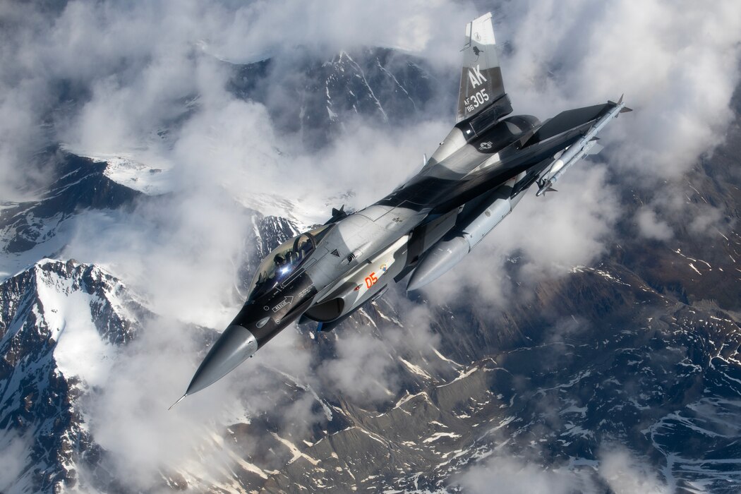 An F-16 Fighting Falcon assigned to the 18th Aggressor Squadron, Eielson Air Force  Base, Alaska, departs after receiving aerial refueling