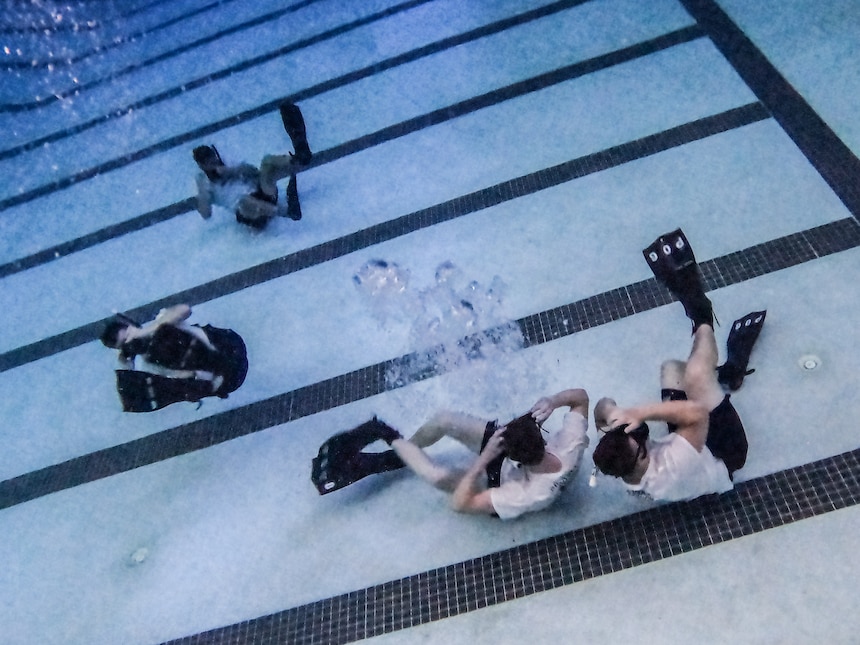 Sailors assigned to Naval Aviation Schools Command (NASC) practice clearing their masks as part of the Aviation Rescue Swimmer School Preparatory Course in Pensacola, Florida, June 21, 2023. NASC is one of the more than 1,640 subordinate learning sites that serve as a part of the Naval Education and Training Command (NETC) domain. NETC's mission is to recruit, train and deliver those who serve our nation, taking them from street-to-fleet by forging civilians into highly skilled, operational and combat ready warfighters. (United States Navy photo by Mass Communication Specialist 1st Class Zachary Melvin)