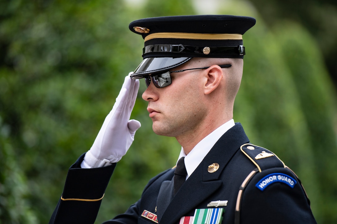 Close-up of a service member saluting.