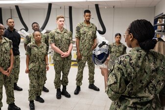 Chief Retail Services Specialist Daphne Lindsay, right,, from Jackson, Mississippi, assigned to Naval Technical Training Center (NTTC) Meridian, instructs students in a simulated ship laundry compartment as part of the retail services specialist “A” school in Meridian, Mississippi, July 1, 2023. NTTC Meridian, under the leadership of Center for Service Support, is one of the more than 1,640 subordinate learning sites that serve as a part of the Naval Education and Training Command (NETC) domain. NETC's mission is to recruit, train and deliver those who serve our nation, taking them from street-to-fleet by forging civilians into highly skilled, operational and combat ready warfighters. (United States Navy photo by Mass Communication Specialist 1st Class Zachary Melvin)