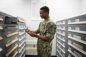 Logistics Specialist Seaman Boluwaji Akinlabi, from Fargo, North Dakota, assigned to Naval Technical Training Center (NTTC) Meridian, practices taking inventory as part of the logistics specialist “A” school in Meridian, Mississippi, July 1, 2023. NTTC Meridian, under the leadership of Center for Service Support, is one of the more than 1,640 subordinate learning sites that serve as a part of the Naval Education and Training Command (NETC) domain. NETC's mission is to recruit, train and deliver those who serve our nation, taking them from street-to-fleet by forging civilians into highly skilled, operational and combat ready warfighters. (United States Navy photo by Mass Communication Specialist 1st Class Zachary Melvin)