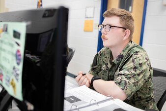 Retail Services Specialist Seaman Wilson Davenport, from Port Orchard, Washington, assigned to Naval Technical Training Center (NTTC) Meridian, completes classwork as part of the retail services specialist “A” school in Meridian, Mississippi, May 31, 2023. NTTC Meridian, under the leadership of Center for Service Support, is one of the more than 1,640 subordinate learning sites that serve as a part of the Naval Education and Training Command (NETC) domain. NETC's mission is to recruit, train and deliver those who serve our nation, taking them from street-to-fleet by forging civilians into highly skilled, operational and combat ready warfighters. (United States Navy photo by Mass Communication Specialist 1st Class Zachary Melvin)