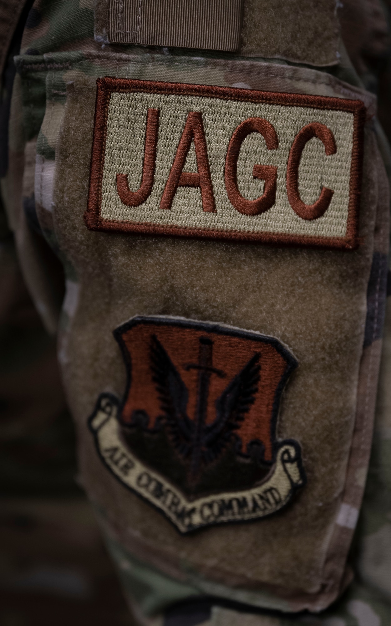 A U.S. Airman assigned to the 4th Fighter Wing wears a judge advocate general corpsman duty identifier at Seymour Johnson Air Force Base, North Carolina, June 21, 2023. The 4th FW legal office is responsible for providing legal assistance to more than 25,000 retired and active-duty military members. (U.S. Air Force photo by Senior Airman David Lynn)