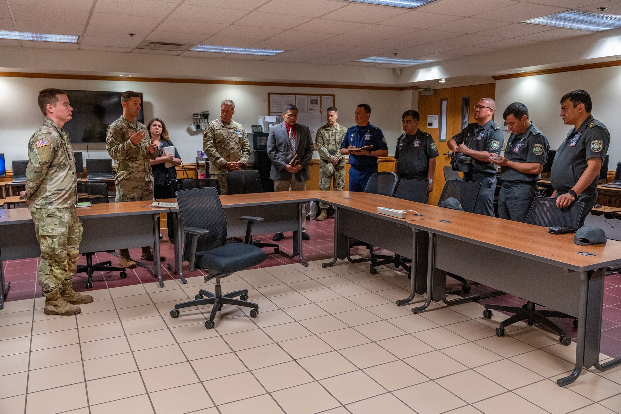 U.S. Air Force Maj. Joseph Smiley, Force Support Training Flight commander, gives an overview of the courses they teach to Senior Officers of the Armed Forces of the Republic of Uzbekistan during a tour of the 335th Training Squadron at Keesler Air Force Base, Mississippi, June 20, 2023.