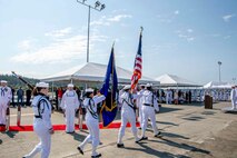 The Navy Region Northwest honor guard presents the 'colors' during a Naval Magazine (NAVMAG) Indian Island change of command ceremony that took place on the ammunition pier in Port Hadlock, Washington, June 22, 2023. During the ceremony, Cmdr. Andrew Crouse was relieved as commander of NAVMAG Indian Island while Cmdr. Todd Galvin assumed his position as the incoming commanding officer. (U.S. Navy photo by Mass Communication Specialist 2nd Class Gwendelyn L. Ohrazda)