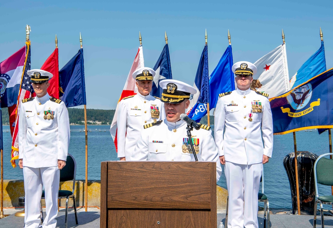Cmdr. Todd Galvin, incoming commanding officer of Naval Magazine (NAVMAG) Indian Island, speaks during a NAVMAG change of command ceremony that took place on the ammunition pier in Port Hadlock, Washington, June 22, 2023. During the ceremony, Cmdr. Andrew Crouse was relieved as commander of NAVMAG Indian Island while Cmdr. Todd Galvin assumed his position as the incoming commanding officer. (U.S. Navy photo by Mass Communication Specialist 2nd Class Gwendelyn L. Ohrazda)