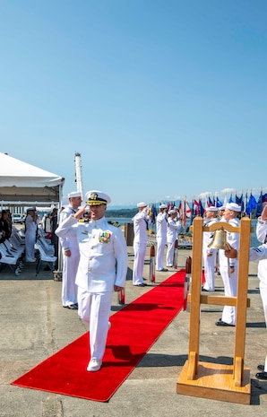 Cmdr. Todd Galvin, incoming commanding officer, is piped ashore during a Naval Magazine (NAVMAG) Indian Island change of command ceremony that took place on the ammunition pier in Port Hadlock, Washington, June 22, 2023. During the ceremony, Cmdr. Andrew Crouse was relieved as commander of NAVMAG Indian Island while Cmdr. Todd Galvin assumed his position as the incoming commanding officer. (U.S. Navy photo by Mass Communication Specialist 2nd Class Gwendelyn L. Ohrazda)