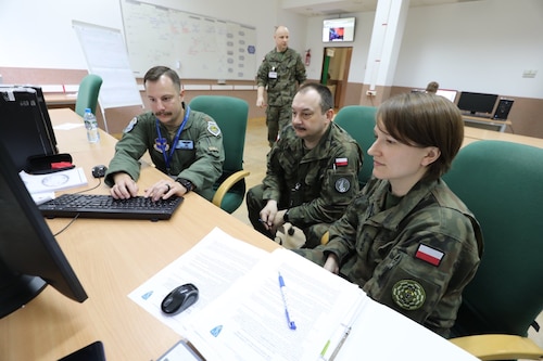 Maj Noah Spitler and two of his Polish colleagues developing military courses of action to present to the COM JFAC (NATO term for what we call the JFACC).