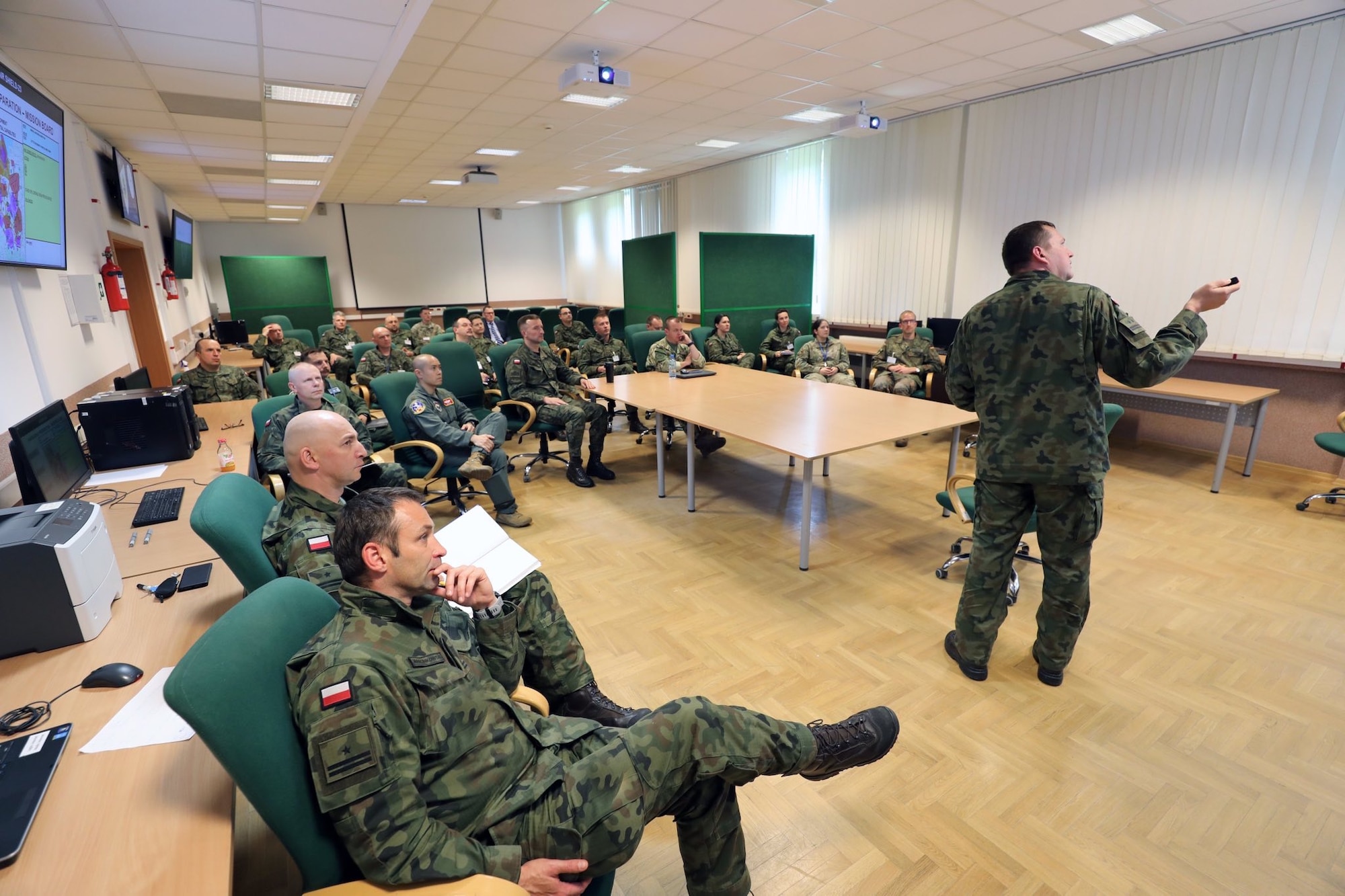 Lt Col Andrzej Krolikowski from the Air Force and Air Defense Department at the Polish War Studies University explains the process that will be used for wargaming the allied courses of action against expected enemy courses of action.
