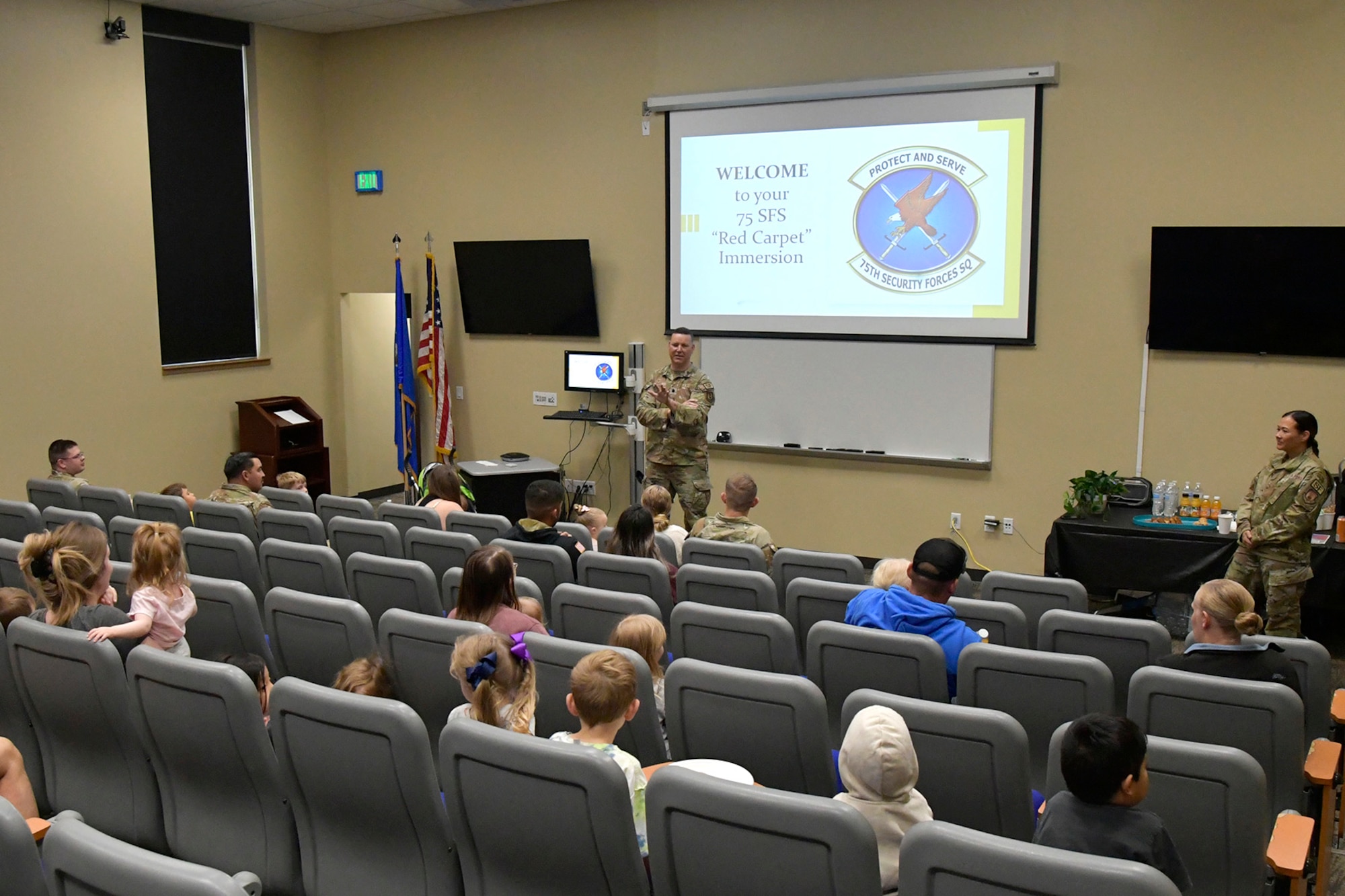 Lt. Col. Cameron Maher, 75th Security Forces Squadron commander, welcomes family members of its squadron’s Defendersto 75th SFS Spouses Day June 15, 2023, at Hill Air Force Base, Utah. This event was held to give family guests a closer look into how the squadron operates on a day-to-day basis and is aimed at further developing a sense of inclusion among the spouses and their families. (U.S. Air Force photo by Todd Cromar)