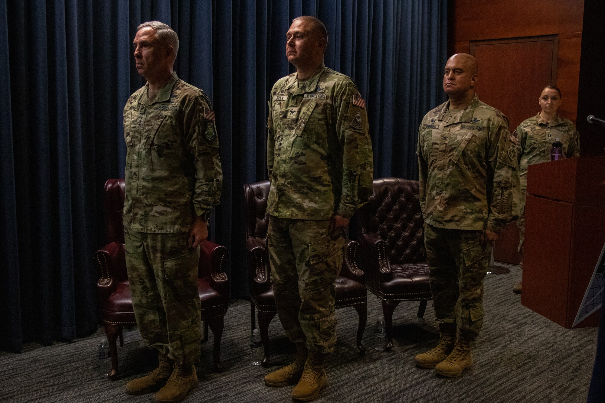 U.S. Space Force Lt. Gen. Stephen Whiting, commander, Space Operations Command, (left) Col. Marc Brock, outgoing commander, Delta 2-Space Domain Awareness (DEL2), (center) and Col. Raj Agrawal, incoming commander, DEL2, (right) stand at attention during DEL2’s Change of Command ceremony June 23, 2023, at Peterson Space Force Base. (U.S. Space Force photo by Emily Peacock)