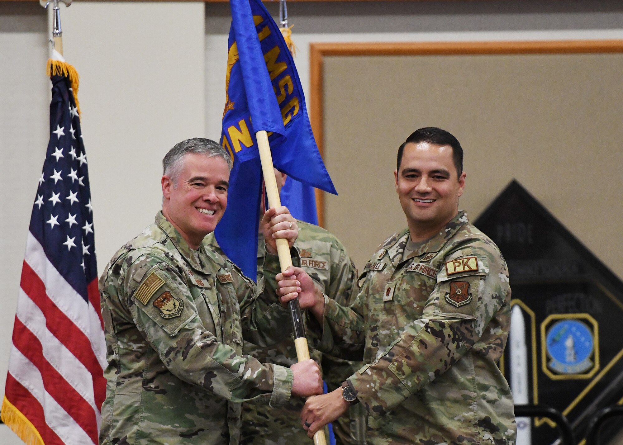 Maj. Sam Trujillo, right, accepts command of the 341st Logistics Readiness Squadron from Col. Christopher Karns, 341st Mission Support Group commander, at Malmstrom AFB, Mont., June 14, 2023.