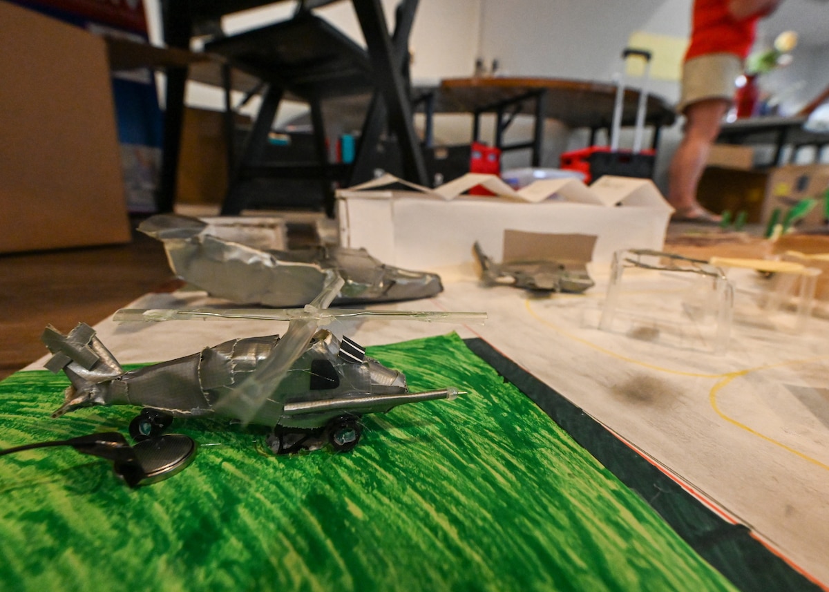 A photo of a model of a helicopter made with tape.