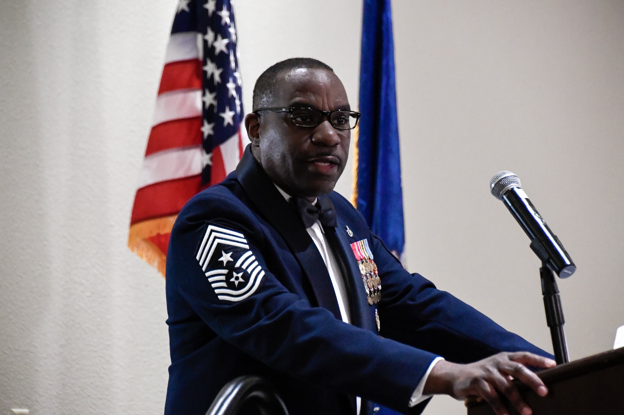 U.S. Air Force Chief Master Sgt. Maurice Williams, command chief, Air National Guard, speaks to the 168th Wing as a guest speaker during their Wing Dining Out. Williams and his wife, Mrs. Gwendolyn Williams, along with his team, attended the Wing Dining Out while visiting the 168th Wing Airmen to learn more about their mission in the Alaska Air National Guard. (U.S. Air National Guard photo by Senior Master Sgt. Julie Avey)