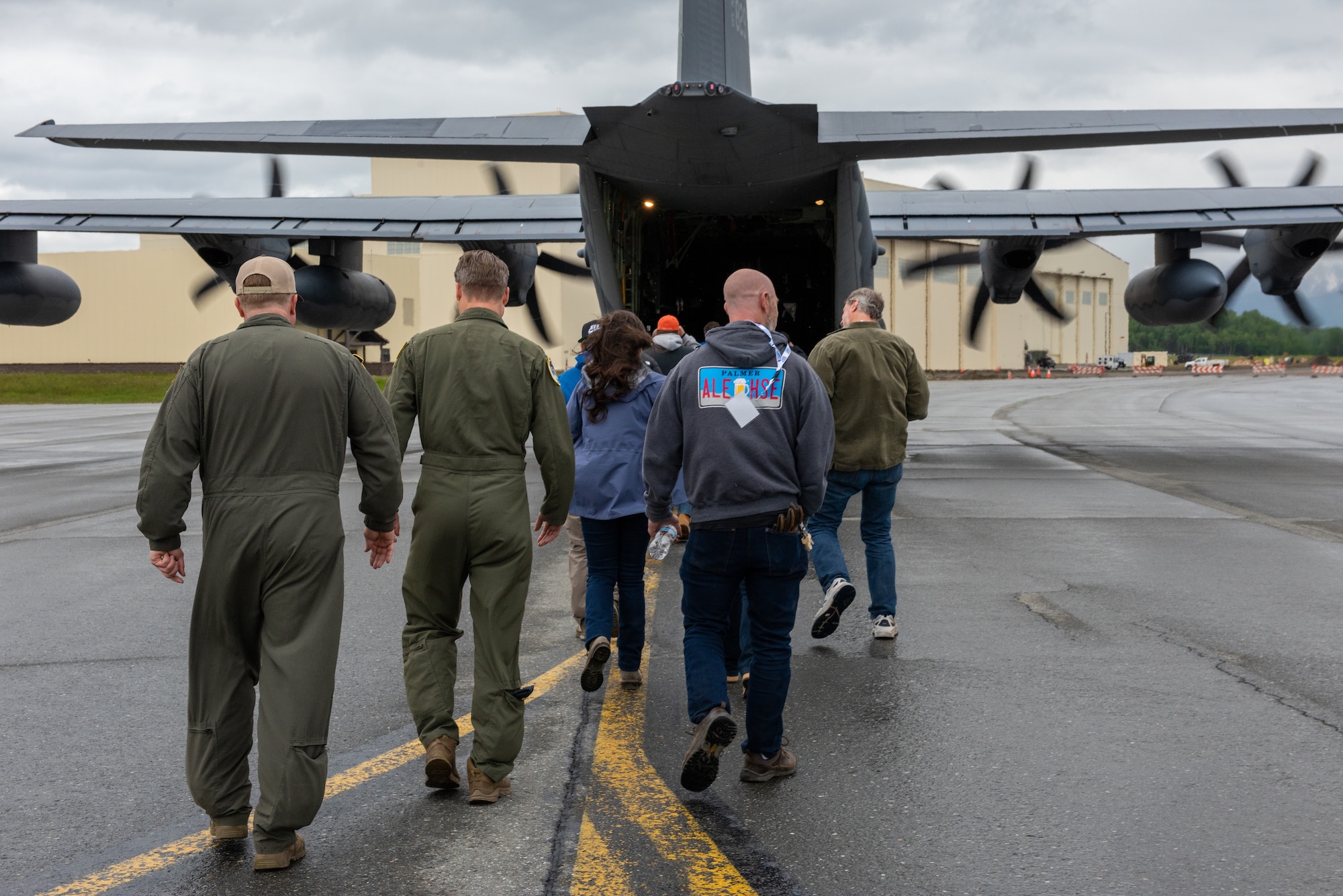Honorary Commanders of the 176th Wing, civilian employers of Alaska National Guard members, and 211th Rescue Squadron aircrew members board a U.S. Air Force HC-130J Combat King II, assigned to the 211th RS for a Boss Lift flight at Joint Base Elmendorf-Richardson, Alaska.