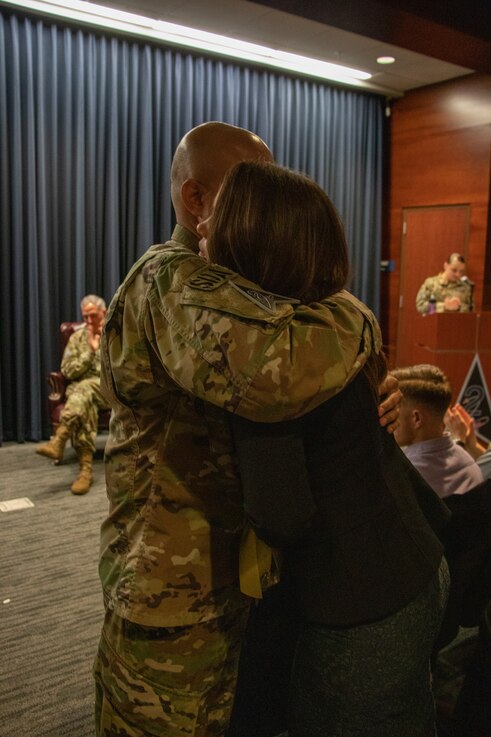  U.S. Space Force Col. Raj Agrawal, commander, Delta 2-Space Domain Awareness (DEL2), embraces wife, Wendy, after assuming command during DEL2’s Change of Command ceremony June 23, 2023, at Peterson Space Force Base. (U.S. Space Force photo by Emily Peacock)