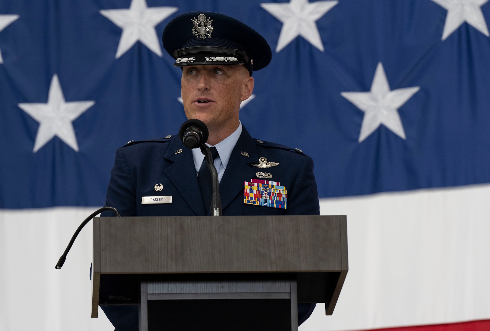 U.S. Air Force Col. Derek C. Oakley, incoming 28th Bomb Wing commander, gives a speech during a change of command ceremony at Ellsworth Air Force Base, South Dakota, June 23, 2023.
