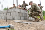 U.S. Air Force Airmen of the 673d Civil Engineer Squadron construct a guard outpost at Camp Mad Bull at Joint Base Elmendorf-Richardson, Alaska.