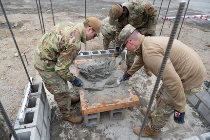 U.S. Air Force Airmen of the 673d Civil Engineer Squadron construct a guard outpost at Camp Mad Bull at Joint Base Elmendorf-Richardson, Alaska.