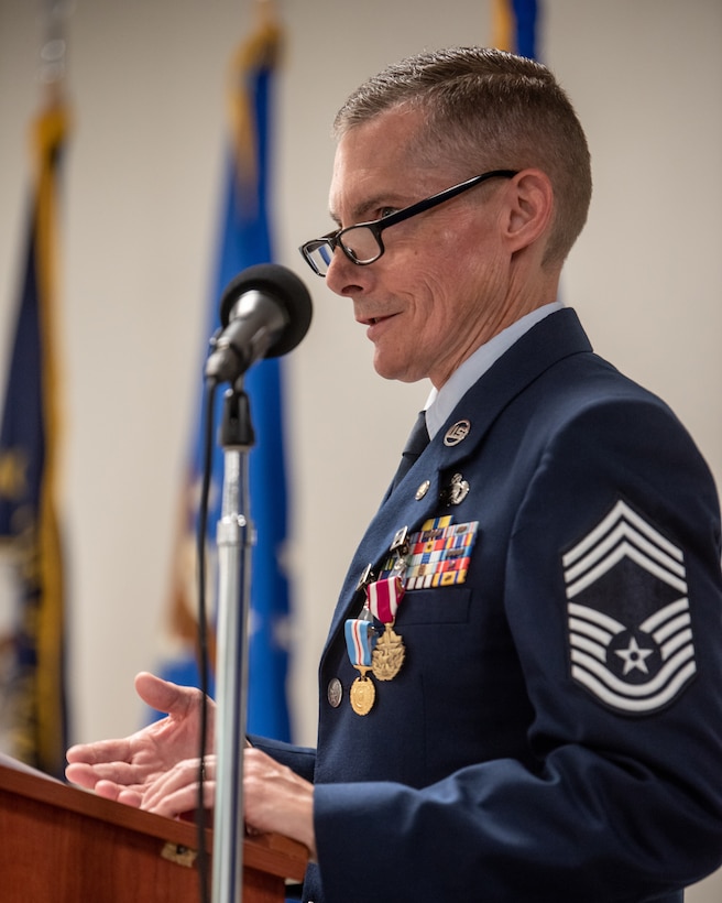 Chief Master Sgt. Donald Hartman, senior enlisted leader for the 123rd Force Support Squadron, speaks to the crowd during his retirement ceremony at the Kentucky Air National Guard Base in Louisville, Ky., May 21, 2023. Hartman is retiring after 23 years of military service. (U.S. Air National Guard photo by Tech. Sgt. Joshua Horton)