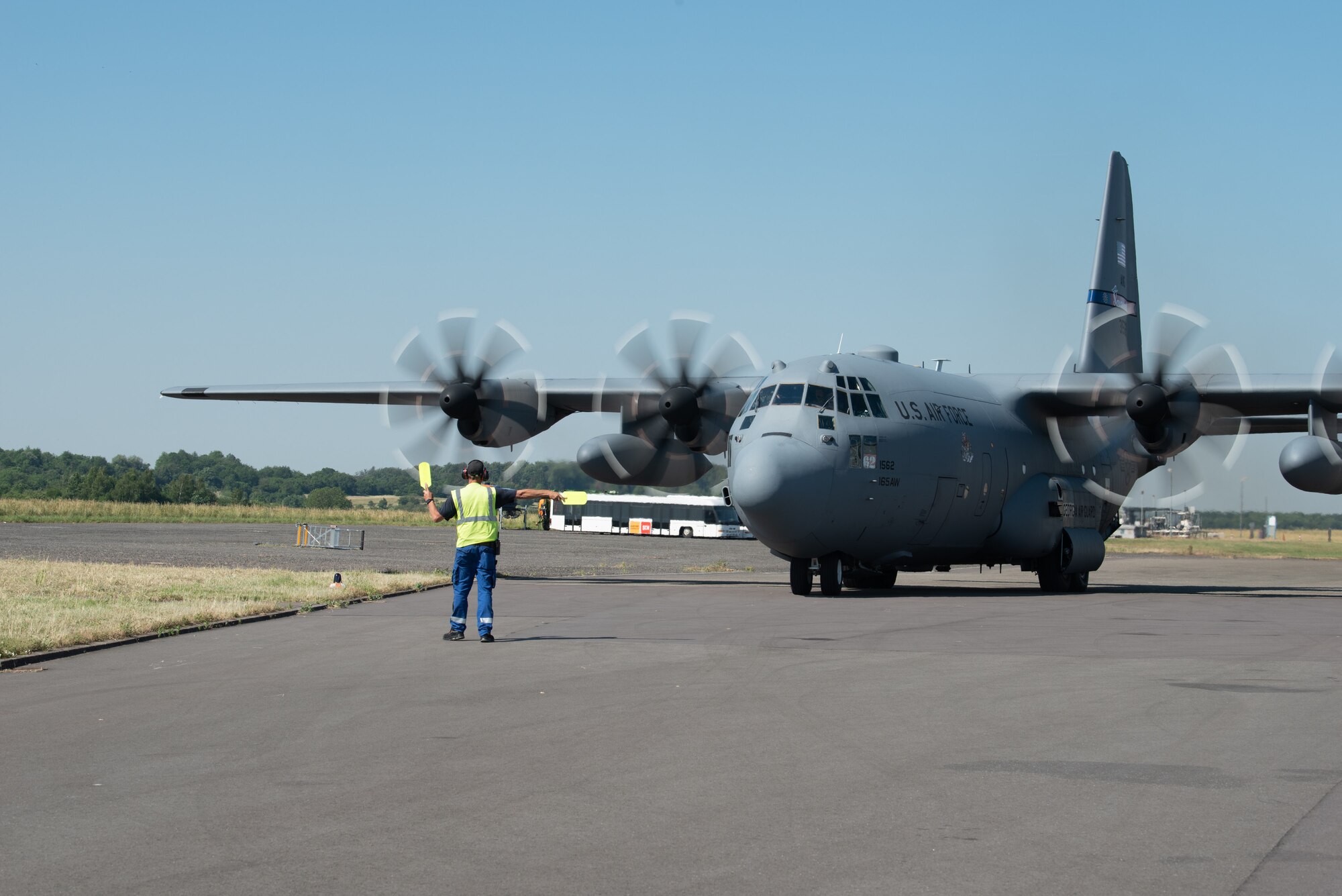 A C-130 Hercules aircraft assigned to the 165th Airlift Wing, Georgia National Guard, is marshaled at Saarbrucken Airport during exercise Air Defender 2023 (AD23) in Saarbrucken, Germany, June 14, 2023. Exercise AD23 integrates both U.S. and allied air-power to defend shared values, while leveraging and strengthening vital partnerships to deter aggression around the world. (U.S. Air National Guard photo by Master Sgt. Phil Speck)