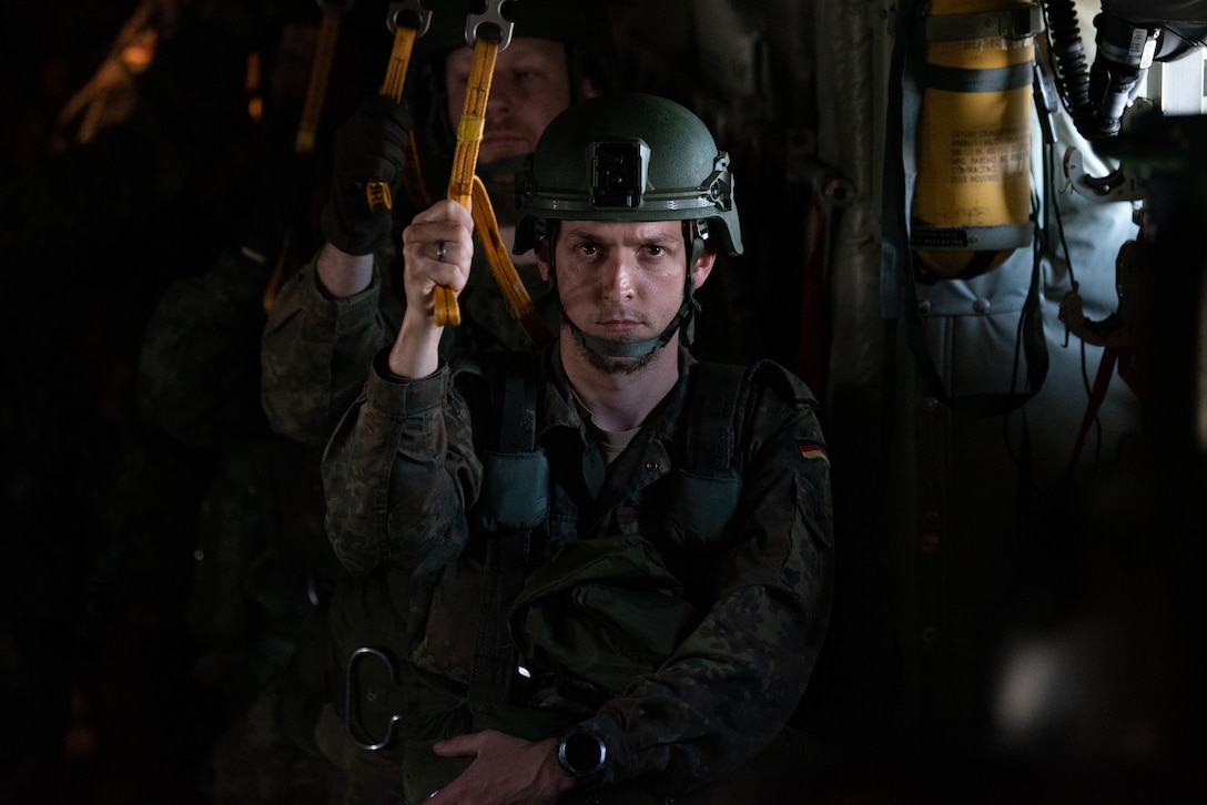 A German paratrooper prepares to jump from a 123rd Airlift Wing C-130J Super Hercules during exercise Air Defender 2023 in Saarbrucken, Germany, June 15, 2023. AD23 integrates both U.S. and allied air-power to defend shared values, while leveraging and strengthening vital partnerships to deter aggression around the world. (U.S. Air National Guard photo by Master Sgt. Phil Speck)