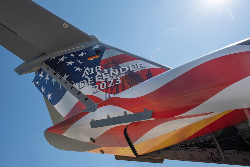 The tail flash of a German Air Force A400 Atlas, painted in honor of Air Defender 2023, on the flightline at Wunstorf Air Base, Wunstorf, Germany, June 12, 2023.  Exercise Air Defender integrates both U.S. and allied air-power to defend shared values, while leveraging and strengthening vital partnerships to deter aggression around the world. (U.S. Air National Guard photo by Master Sgt. Phil Speck)