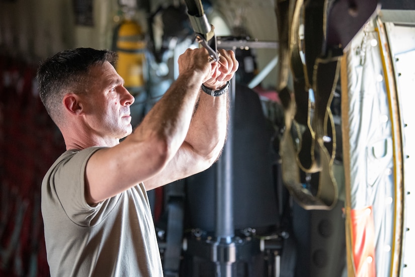 Master Sgt. Chris Kinberger, a loadmaster assigned to the Kentucky Air National Guard’s 165th Airlift Squadron, rigs a static line on a 123rd Airlift Wing C-130J Super Hercules during exercise Air Defender 2023 in Saarbrucken, Germany, June 15, 2023. AD23 integrates both U.S. and allied air-power to defend shared values, while leveraging and strengthening vital partnerships to deter aggression around the world. (U.S. Air National Guard photo by Master Sgt. Phil Speck)
