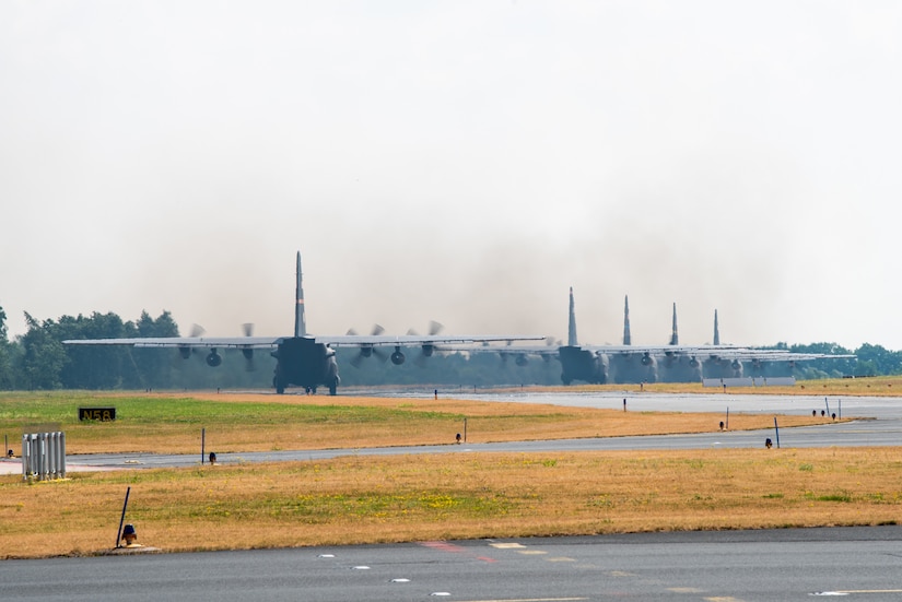 Five U.S. Air Force C-130 Hercules aircraft prepare to takeoff at Wunstorf Air Base during exercise Air Defender 2023 (AD23) in Wunstorf, Germany, June 21, 2023. Exercise AD23 integrates both U.S. and allied air-power to defend shared values, while leveraging and strengthening vital partnerships to deter aggression around the world. (U.S. Air National Guard photo by Master Sgt. Phil Speck)