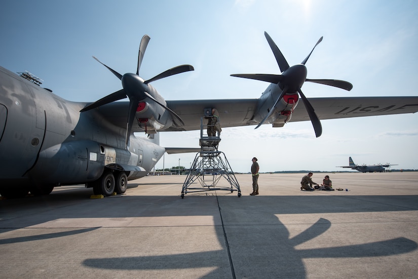 U.S. Airmen, aircraft maintainers, assigned to the 123rd Maintenance Group, 123rd Airlift Wing, Kentucky National Guard, and the 165th Maintenance Squadron, 165th Airlift Wing, Georgia National Guard, work on a U.S. Air Force C-130J Super Hercules during Air Defender 2023 (AD23) at Wunstorf Air Base, Germany, June 19, 2023. Exercise AD23 integrates both U.S. and allied air-power to defend shared values, while leveraging and strengthening vital partnerships to deter aggression around the world. (U.S. Air National Guard photo by Master Sgt. Phil Speck)