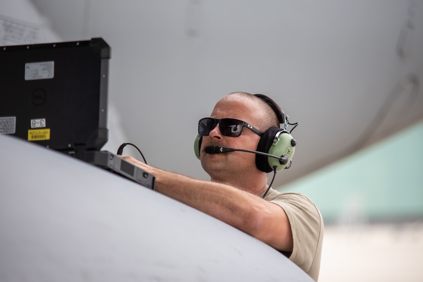 A U.S. Airman with the 145th Airlift Wing, North Carolina National Guard, checks the diagnostics of a C-17 Globemaster III aircraft in preparation for exercise Air Defender 2023 (AD23) at Wunstorf Air Base, Germany, June 6, 2023. Exercise AD23 integrates both U.S and allied air-power to defend shared values, while leveraging and strengthening vital partnerships to deter aggression around the world. (U.S. Air National Guard photo by Senior Master Sgt. Vicky Spesard)