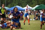 Tech Sgt. Tanya Siford of Anderson AFB, Guam leads the way to victory during Air Force's defeat of Army during the 2023 Armed Forces Sports Women's Rugby Championship held in conjunction with the Cape Fear 7's Rugby Tournament in Wilmington, N.C. Championship features teams from the Army, Marine Corps, Navy, Air Force (with Space Force players), and Coast Guard. (Dept. of Defense Photo by Mr. Steven Dinote, Released)