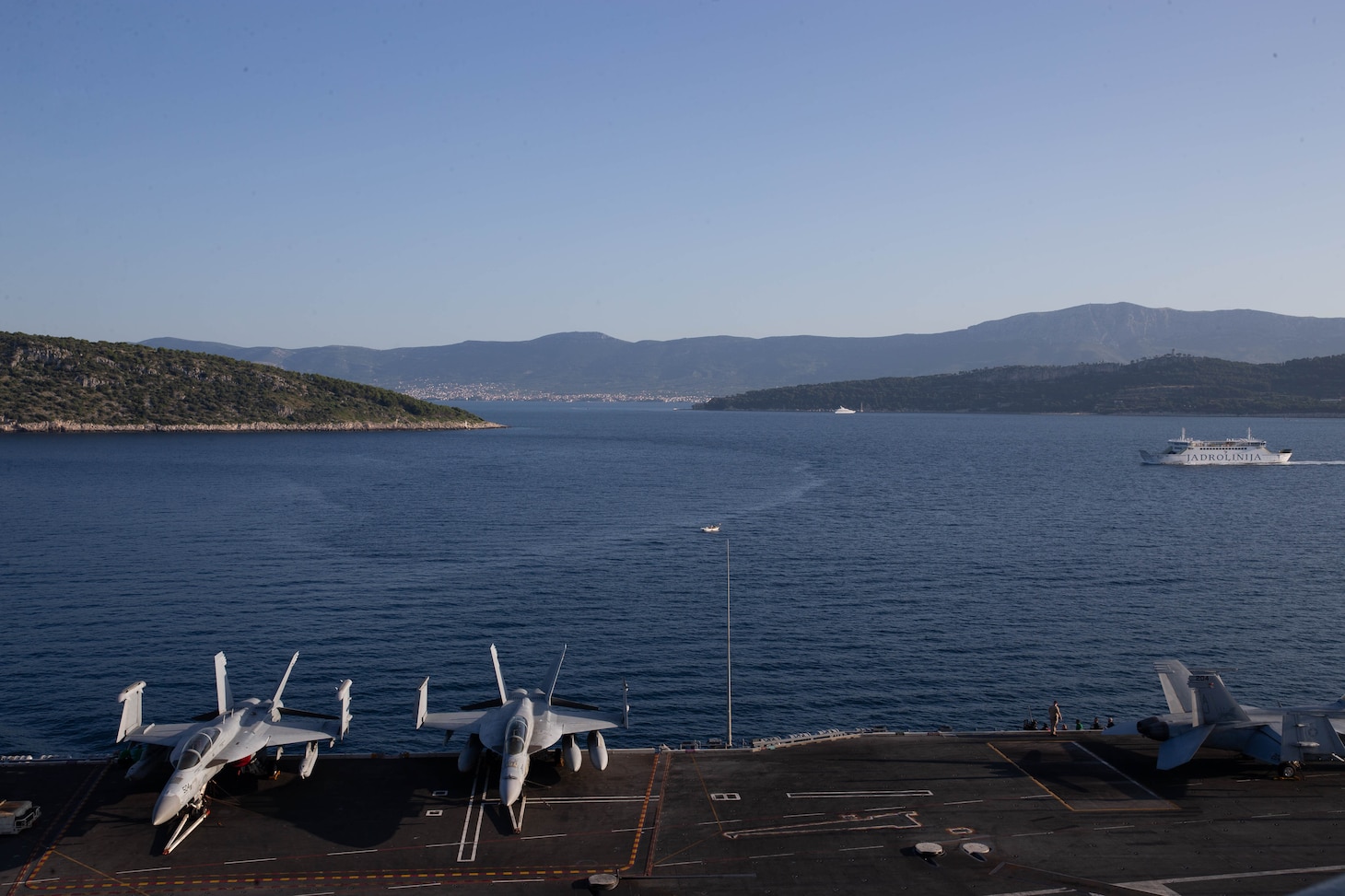 The world's largest aircraft carrier USS Gerald R. Ford (CVN 78) arrives in Split, Croatia for a scheduled port visit, June 26, 2023. Gerald R. Ford is the U.S. Navy's newest and most advanced aircraft carrier, representing a generational leap in the U.S. Navy's capacity to project power on a global scale. The Gerald R. Ford Carrier Strike Group is on a scheduled deployment in the U.S. Naval Forces Europe area of operations, employed by U.S. Sixth Fleet to defend U.S., allied, and partner interests. (U.S. Navy photo by Mass Communication Specialist 2nd Class Jacob Mattingly)