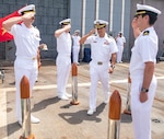 230625-N-KW492-0428 DA NANG, VIETNAM (June 25, 2023) Sailors salute Commanding Officer Capt. Victor Garza, from Gilroy, California, as he departs during a change of command ceremony aboard the Ticonderoga-class guided-missile cruiser USS Antietam (CG 54) in Da Nang, Vietnam, June 25, 2023. Antietam is assigned to Commander, Task Force (CTF) 70, and is forward-deployed to Yokosuka, Japan to support the security of the U.S. and its Allies in the Indo-Pacific. (U.S. Navy photo by Mass Communication Specialist 1st Class Ryre Arciaga)