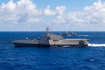 PHILIPPINE SEA (June 22, 2023) – The Independence-variant littoral combat ship USS Manchester (LCS 14) and Formidable-class stealth frigate RSS Tenacious (71) (right) transit the Philippine Sea during Exercise Pacific Griffin, June 22. Pacific Griffin 2023 is the fourth iteration of the biennial maritime exercise between the U.S. and Republic of Singapore. Pacific Griffin 2023 is the fourth iteration of the biennial maritime exercise between the U.S. and Republic of Singapore. Conducted in the waters near Guam, the two navies enhance combined maritime proficiency while strengthening relationships during two weeks of dynamic training evolutions ashore and at sea. Littoral Combat Ships are fast, optimally manned, mission-tailored surface combatants that operate in near-shore and open-ocean environments, winning against 21st-century coastal threats. Manchester, part of Destroyer Squadron 7, is on a rotational deployment operating in the U.S. 7th Fleet area of operations to enhance interoperability with Allies and partners and serve as a ready-response force in support of a free and open Indo-Pacific region. (U.S. Navy photo by Mass Communication Specialist 2nd Class Christopher Thomas)