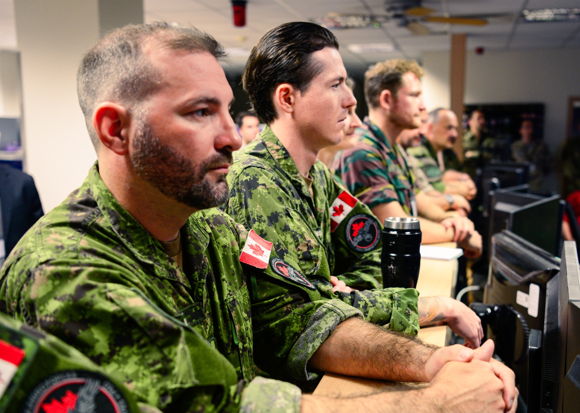 Royal Canadian Air Force airmen attend a briefing at the European Partnership Integration Enterprise during exercise Unified Vision 2023 at Ramstein Air Base, Germany, June 22, 2023. NATO allies and partners routinely serve together, both operationally and during exercises, enhancing relationships in the alliance, ensuring timely and coordinated responses in peacetime and crises.