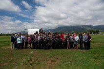 Group of people pose for photo.