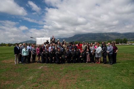 Group of people pose for photo.