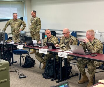 Senior leaders of 91st Cyber Brigade talk to each other