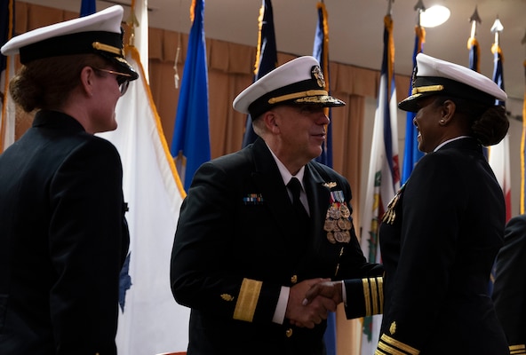 Rear Adm. Matthew Case, commander, Naval Medical Forces Atlantic, and chief of the Medical Service Corps, congratulates Capt. Tracey R. Giles, commanding officer of Navy Medicine Readiness and Training Command (NMRTC) Fort Belvoir at a change of command ceremony at the Woodlawn Chapel onboard Fort Belvoir June 23.