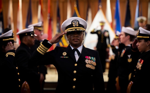 Capt. Melissa C. Austin, left, the first commanding officer of Navy Medicine Readiness and Training Command (NMRTC) Fort Belvoir is relieved by Capt. Tracey R. Giles during a change of command ceremony at the Woodlawn Chapel onboard Fort Belvoir June 23.