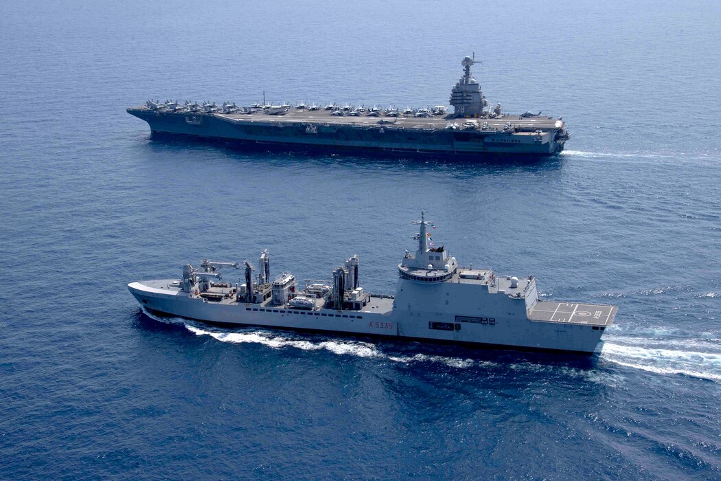 USS Gerald R. Ford (CVN 78) and ITS Vulcano (A 5335) transit the Adriatic Sea.